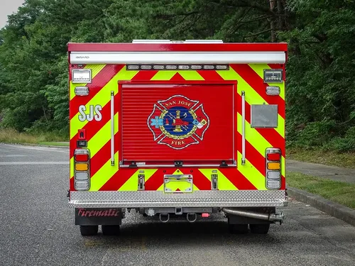 Straight rear view with chevron striping and department emblem.