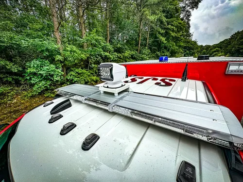 Cab roof close-up with marker lights and roof-mounted rail hardware.