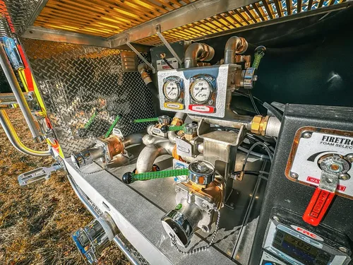 Rear pump compartment close-up from side showing control cluster.