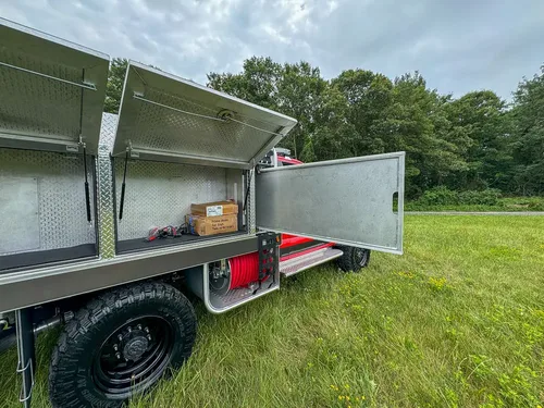 Right-side compartments open with mid-body door swung outward.