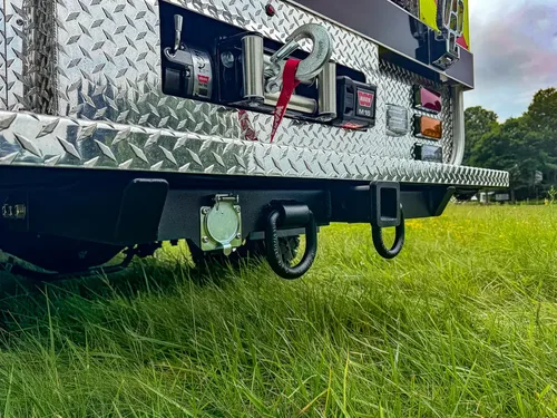 Rear underside close-up with tow hooks and lower bumper area.