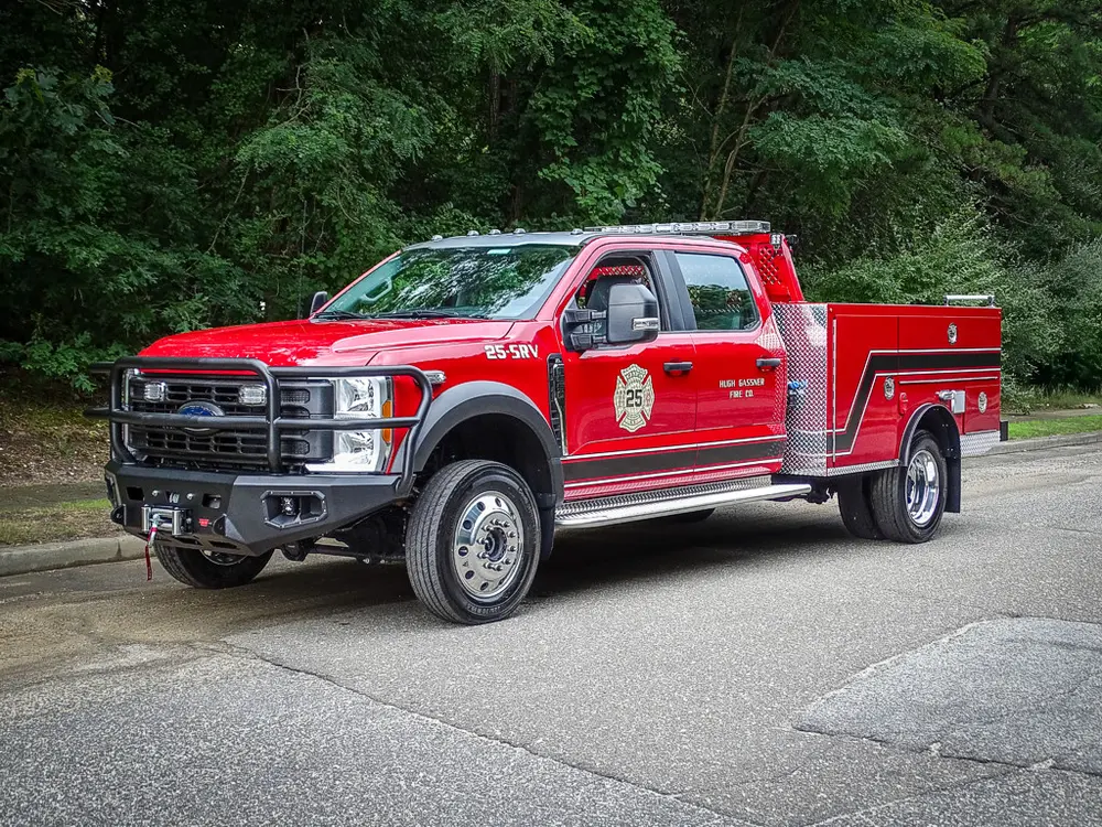 Front-left three-quarter exterior view of the red patrol-style fire truck.
