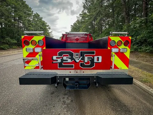 Straight rear view showing chevron rear panel and tailgate.