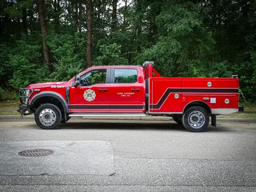 Full left-side profile of the truck parked on roadway.