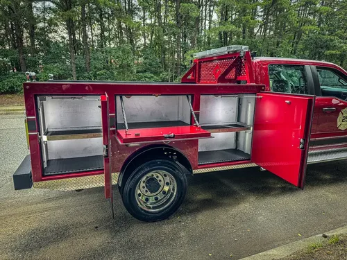 Right-side view with multiple compartment doors open showing shelves.