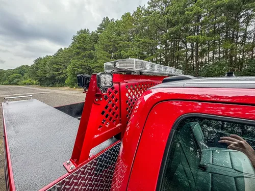 Rear upper rack and side panel close-up behind the cab.