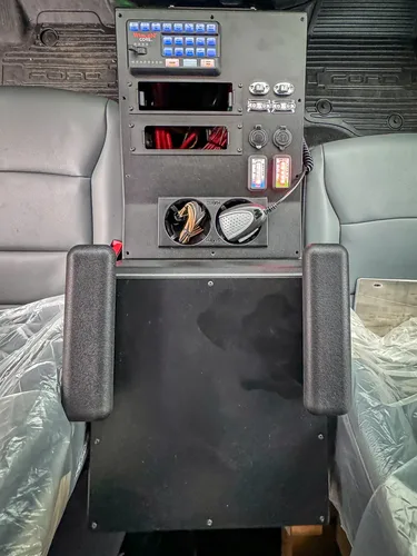 Rear center console close-up with dials and control knobs.
