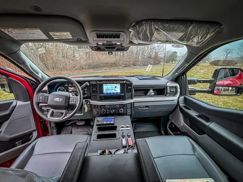 Wide front interior view across dashboard and center console.
