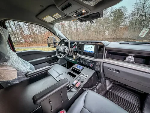 Front passenger interior view showing dashboard and center console.