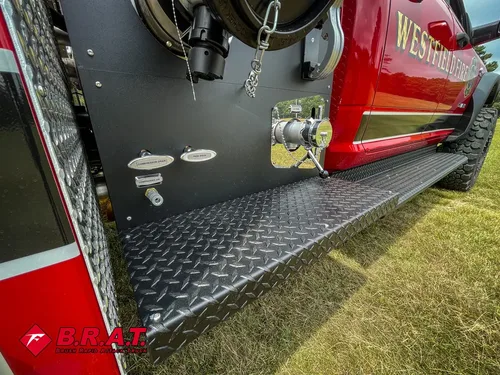 Side pump panel view with intake ports and mounted hose fittings.