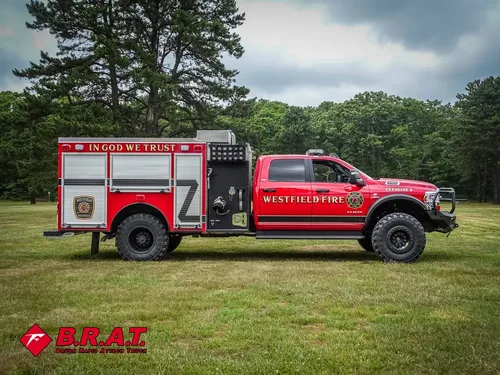 Full right-side profile of the truck with side compartments and cab.