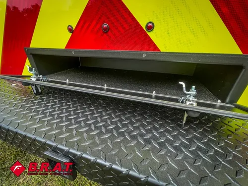 Lower rear hatch open showing underside latching hardware.