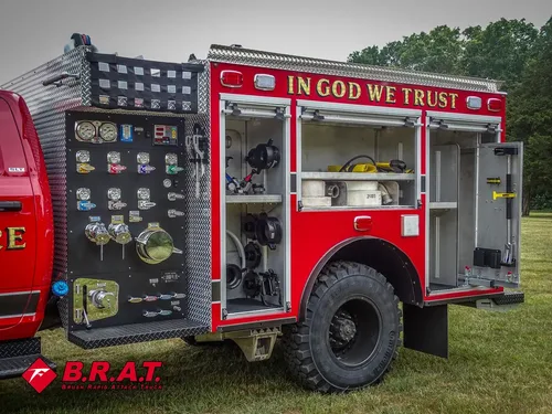 Pump-side control panel and open compartments on the truck's left side.