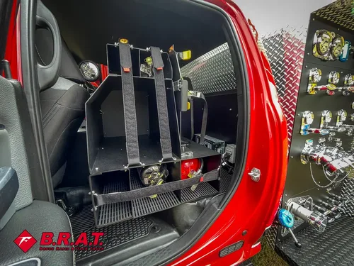 Rear seating area from opposite side showing equipment rack and floor space.