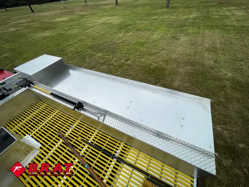 Upper deck side view with fold-down panel above yellow grating.