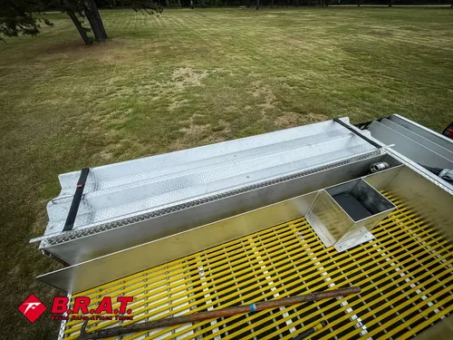 Top walkway close-up with yellow grating and side rail trim.