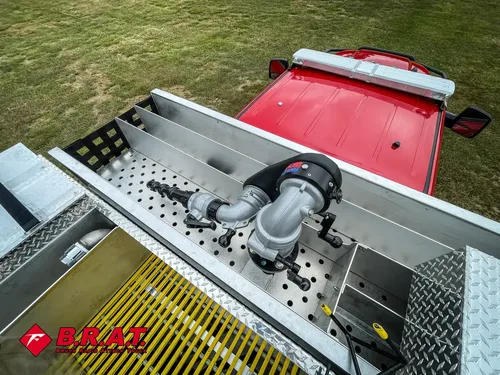 Top deck front section with mounted nozzle assembly and control linkage.