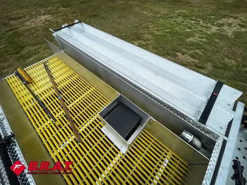 Top deck from rear angle showing long yellow grated walkway.