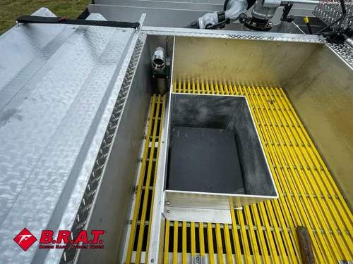Upper grating close-up with recessed hatch opening in walkway.