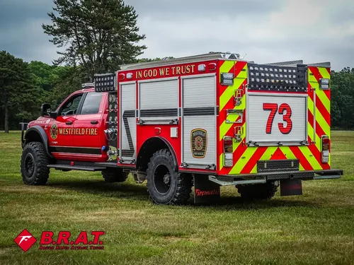 Rear-right angle of the truck showing side compartments and rear chevrons.