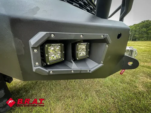 Front bumper close-up with dual square auxiliary lights.