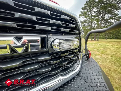 Grille close-up with center light bar and RAM emblem.