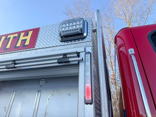 Close-up of upper side scene light and vertical warning light strip.