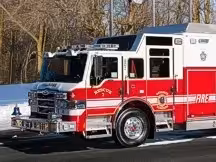 Bellmore heavy rescue truck front-left exterior view showing enclosed cab and rescue body compartments