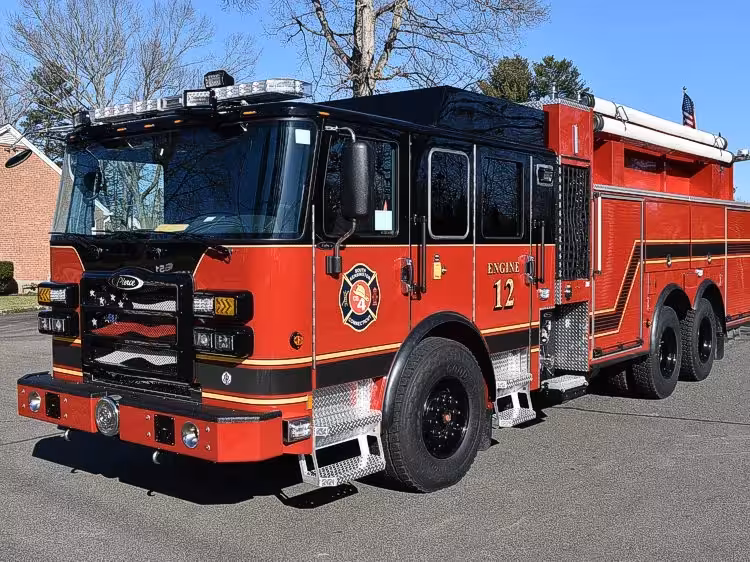 Pumper front-left exterior view showing dark cab top and side body