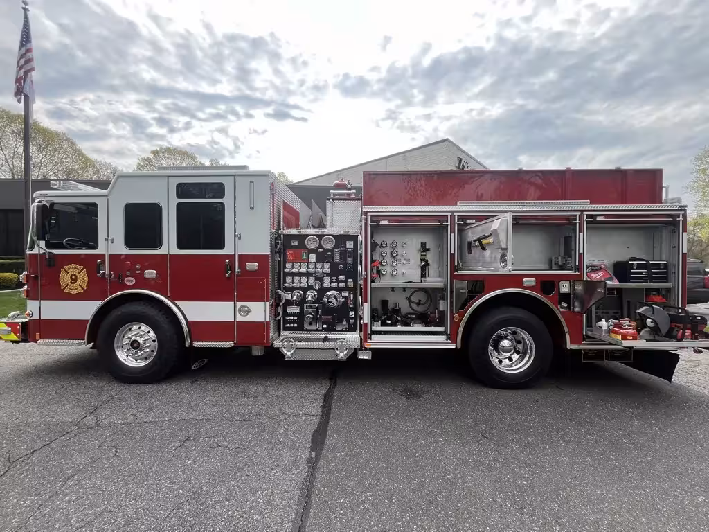 Pierce Saber pumper, officer-side profile view showing pump panel and side compartments