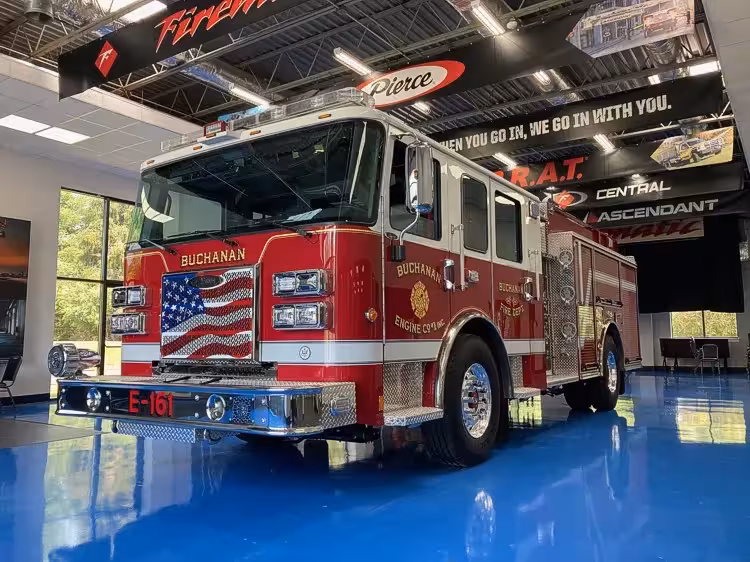 Pumper front-left exterior view showing grille, bumper, and side body