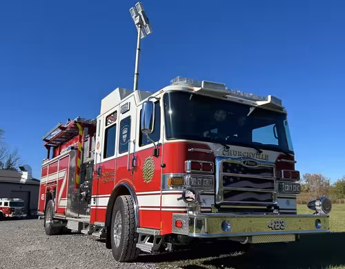 Pierce pumper front-right exterior view with side body and front wheel visible
