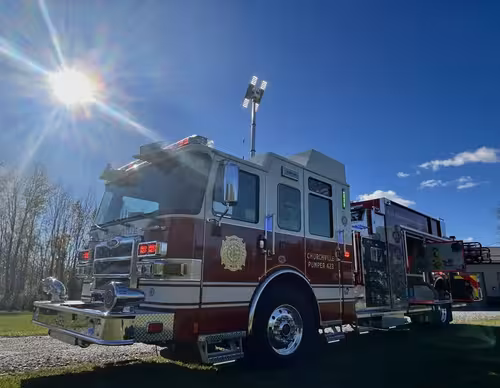Pierce pumper passenger-side profile with cab, pump panel area, and rear body