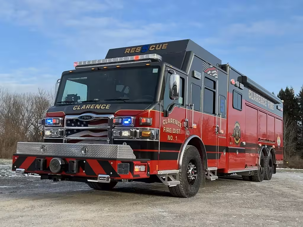 Aerial ladder truck front-left exterior view showing cab, grille, and bumper