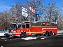 Heavy rescue truck front-left exterior view showing full side body