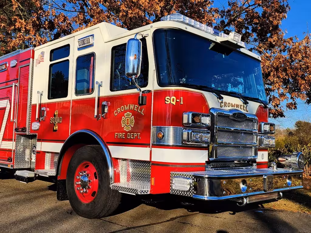 Rescue pumper front-left exterior view showing grille, bumper, and cab
