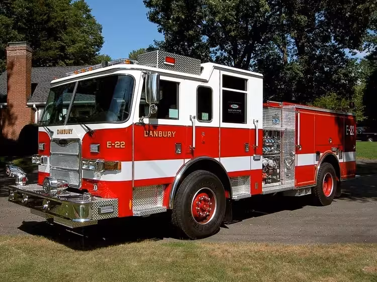 Pumper front-left exterior view showing enclosed cab and side compartments
