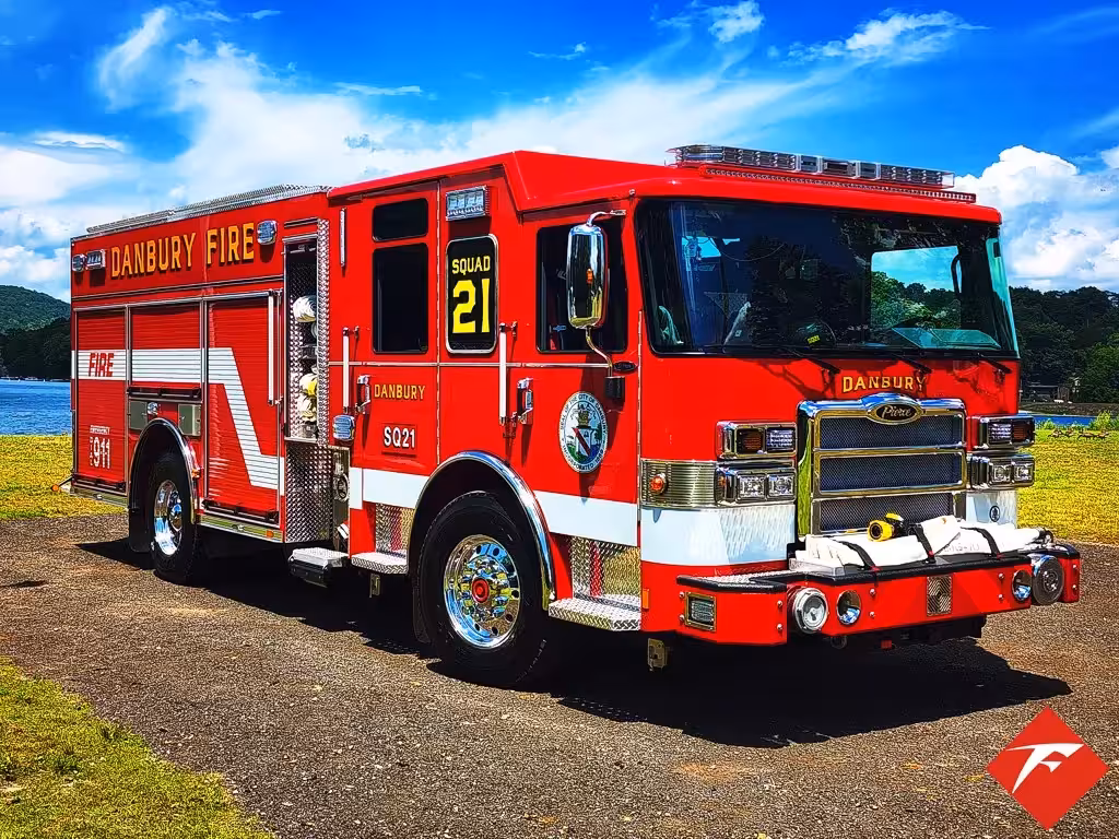 Rescue pumper front-left exterior view showing enclosed cab and side body