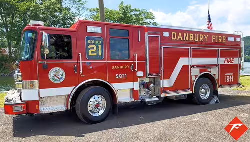 Rescue pumper side profile view showing full body and wheelbase