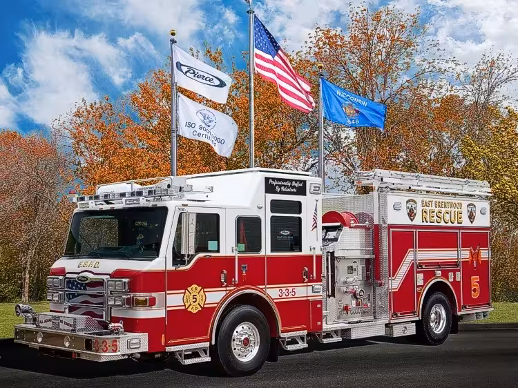 Pierce rescue pumper front-left exterior view with roof ladders and side compartments