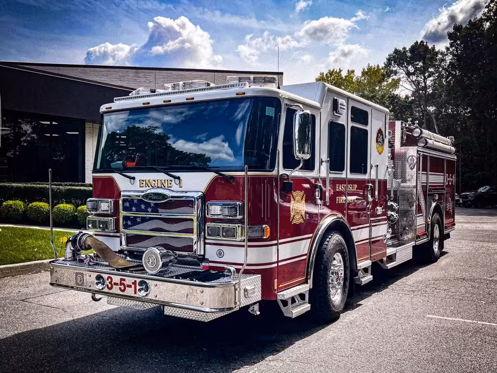 Pumper front-left exterior view showing grille, bumper, and side body