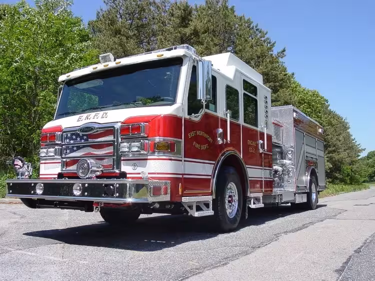 Low front-left exterior view showing grille, bumper, and cab