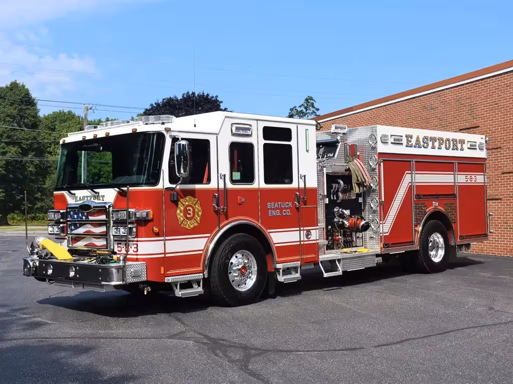 Pumper front-left exterior view showing cab, grille, and side body