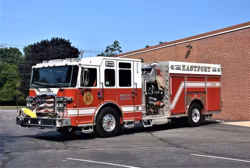Pumper front-left profile showing side body and rear wheel area