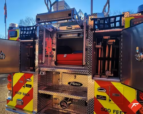 Open rear compartment showing slide-out tray and rear chevron panel
