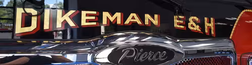 Front grille close-up strip showing company lettering