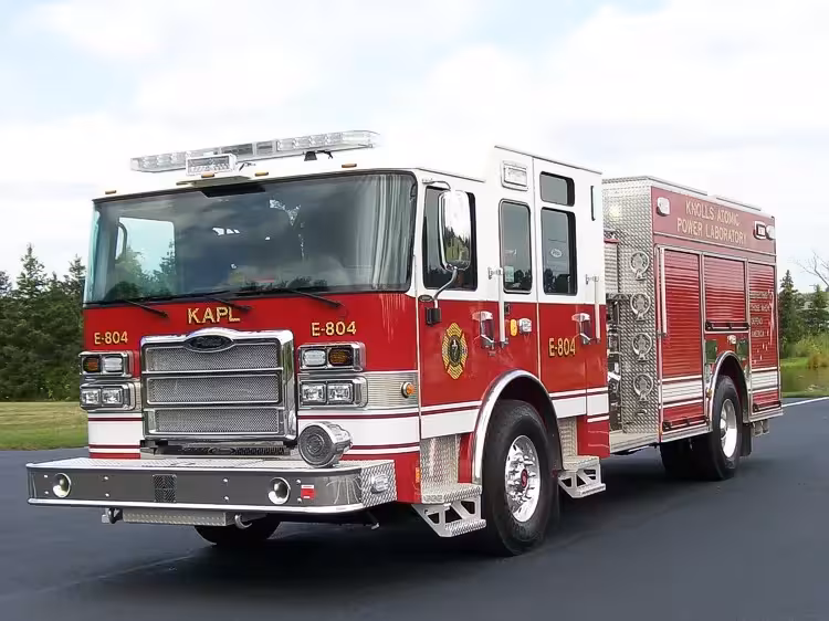 Rescue pumper front-left exterior view showing enclosed cab and side body