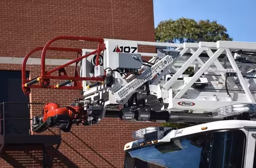 Ladder tip close-up showing front nozzle and red safety rails