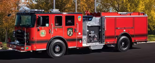 Pumper driver-side profile view showing full body and side compartments