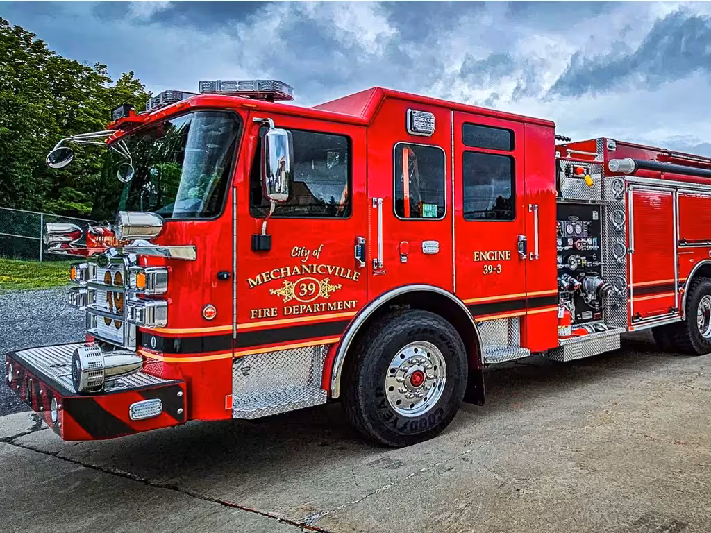 Pumper front-left exterior view showing grille, bumper, and side body